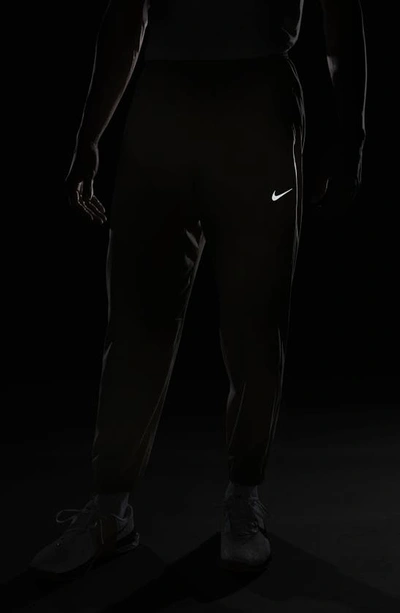 Shop Nike Dri-fit Tapered Versatile Pants In Khaki/ Black/ Silver