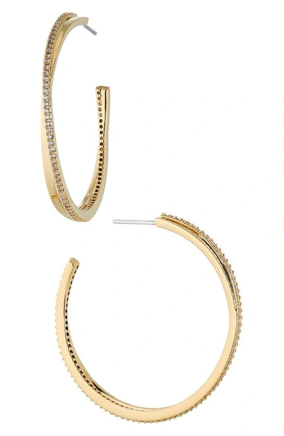 Shop Nadri Disco Crossover Hoop Earrings In Gold