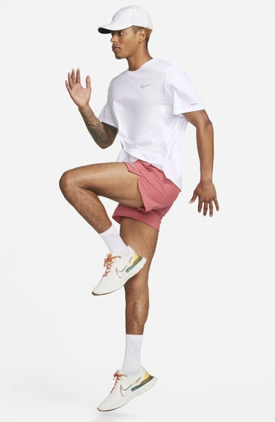 Shop Nike Dri-fit Stride 5-inch Running Shorts In Adobe/ Red Stardust