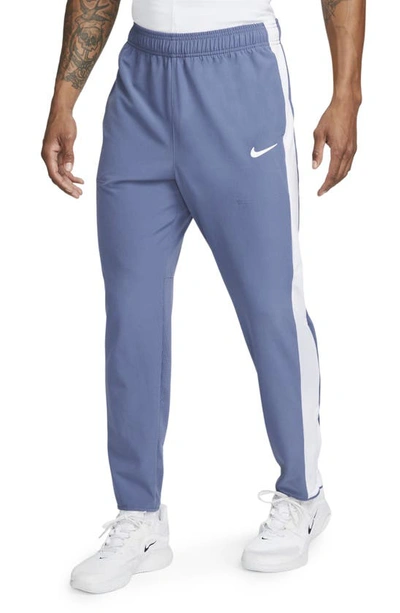 Shop Nike Court Advantage Stretch Tennis Pants In Diffused Blue/ White/ White