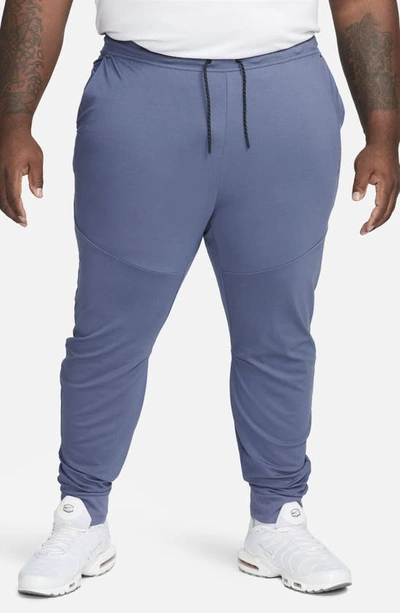 Shop Nike Tech Essentials Joggers In Diffused Blue/ Diffused Blue
