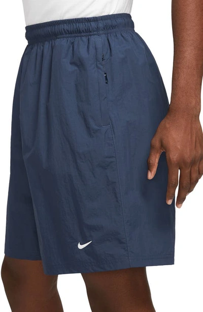 Shop Nike Solo Swoosh Water Repellent Nylon Shorts In Midnight Navy/ White