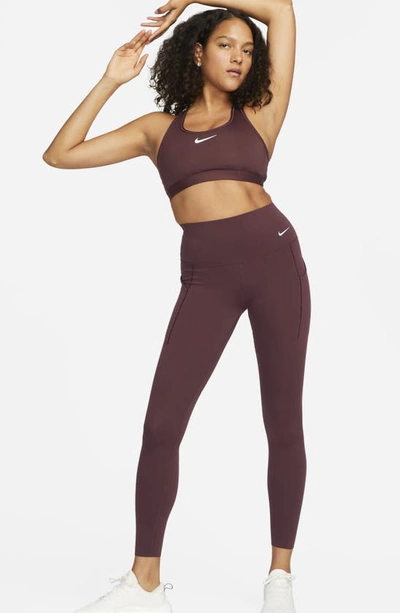 Shop Nike Universa Dri-fit Medium Support High Waist Leggings In Earth/ Black