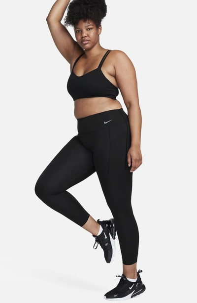 Shop Nike Universa Dri-fit Medium Support Mid Rise 7/8 Leggings In Black/ Black
