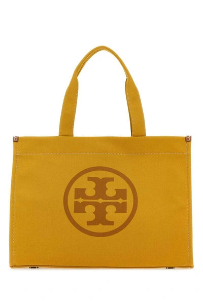 Shop Tory Burch Handbags. In Yellow