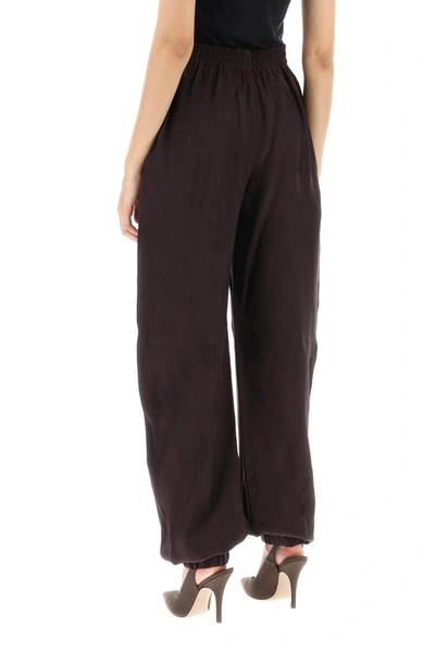 Shop Attico The  Monogram Jacquard Pants In Brown