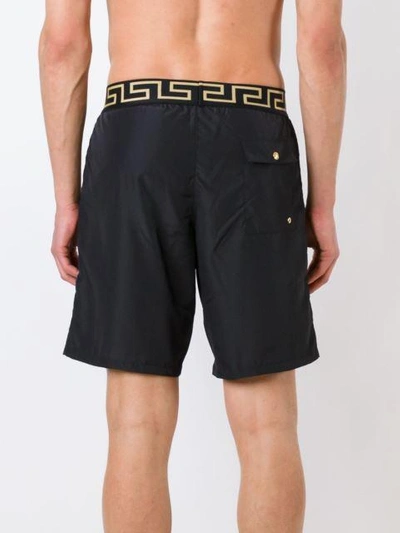 Shop Versace 'iconic Greca Medusa' Swim Shorts In Black