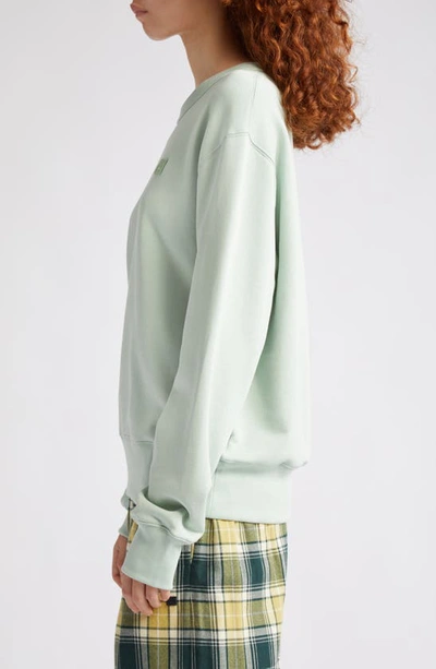 Shop Acne Studios Fairah Face Patch Oversize Cotton Sweatshirt In Soft Green