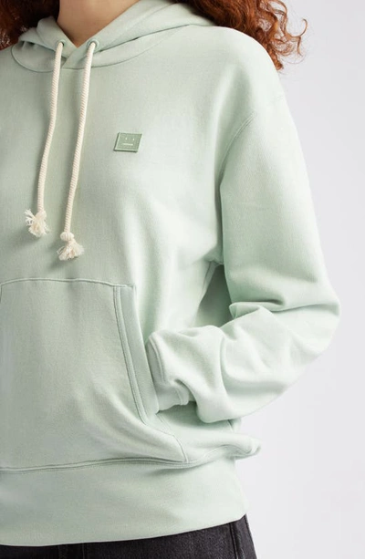 Shop Acne Studios Fairah Face Patch Oversize Cotton Hoodie In Soft Green