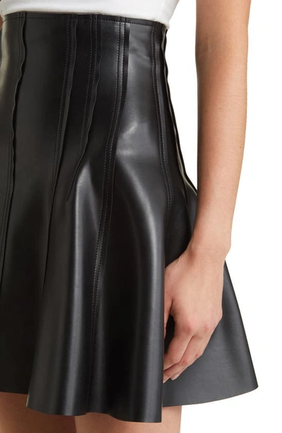 Shop Norma Kamali Grace Faux Leather Miniskirt In Black