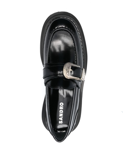 Shop Sandro Buckle-embellished Leather Loafers In Black