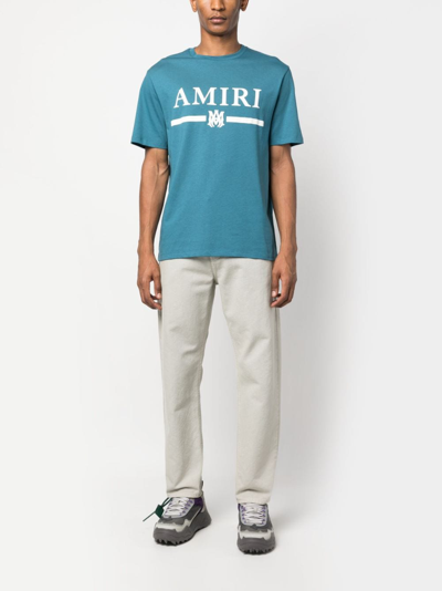 Shop Amiri Logo-print Cotton T-shirt In Blue