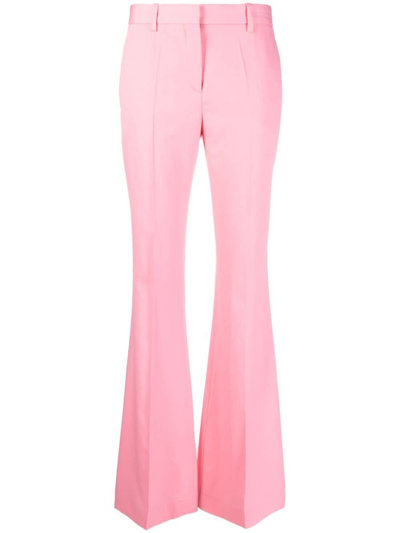 Shop Versace Flared Virgin Wool Trousers In Pink