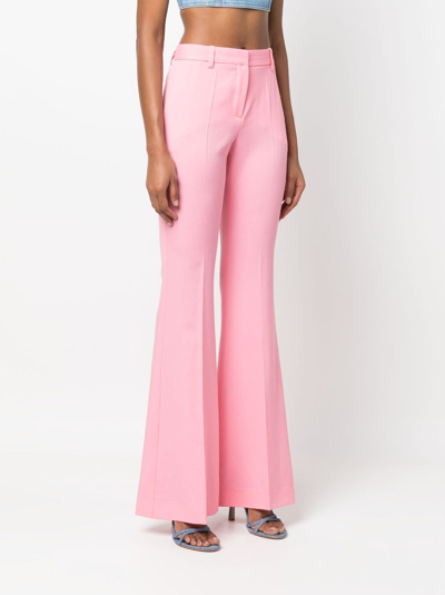 Shop Versace Flared Virgin Wool Trousers In Pink