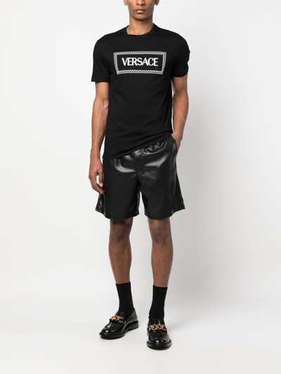Versace Black Crewneck T-shirt With Contrasting Logo Lettering Print In Cotton