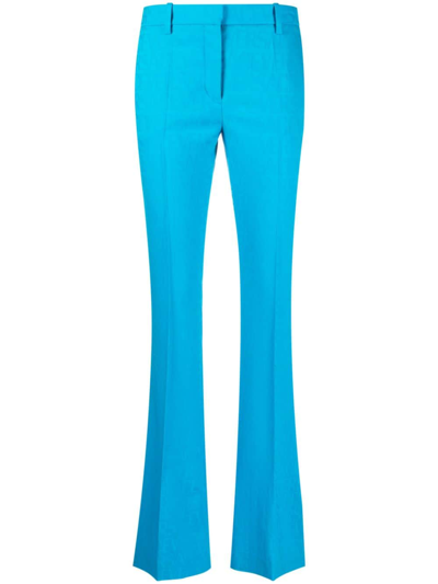 Shop Versace Allover Jacquard Trousers In Blue