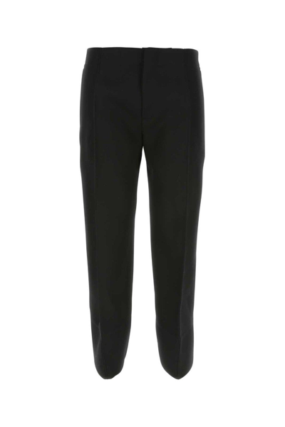 Shop Bottega Veneta Curved Cut-out Hem Tailored Pants In Black