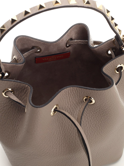 Shop Valentino Rockstud Bucket Bag In Grey
