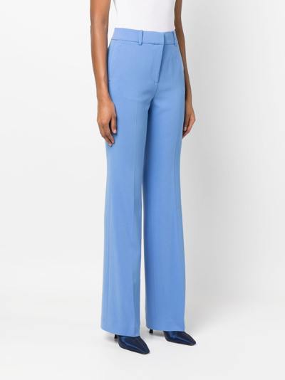 Shop Michael Michael Kors Tailored-cut Straight-leg Trousers In Blue