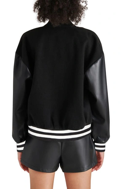 Shop Steve Madden Alexandra Faux Leather Sleeve Varsity Jacket In Black