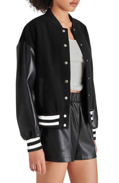 Shop Steve Madden Alexandra Faux Leather Sleeve Varsity Jacket In Black