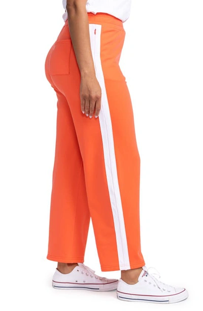 Shop Kinona Cozy Wide Leg Golf Pants In Coral Red
