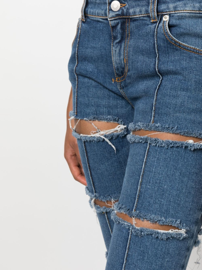 Shop Alexander Mcqueen Distressed Cropped Jeans In Blau