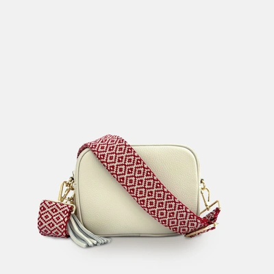 Shop Apatchy London Stone Leather Crossbody Bag With Red Cross-stitch Strap In White