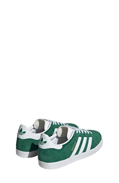 Shop Adidas Originals Kids' Gazelle Sneaker In Dark Green/ Cloud White/ White