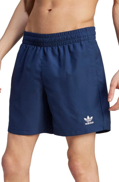 Shop Adidas Originals Essentials Solid Swim Trunks In Night Indigo