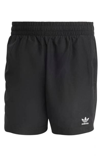 Shop Adidas Originals Essentials Solid Swim Trunks In Black/ White