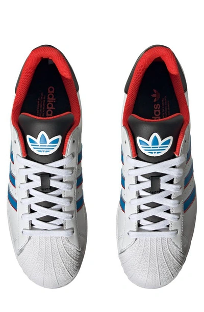 Shop Adidas Originals Superstar Lifestyle Sneaker In White/ Bright Blue/ Red