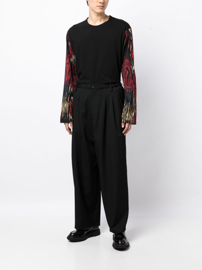 Shop Yohji Yamamoto Tapered-leg Pleat-detail Trousers In Black