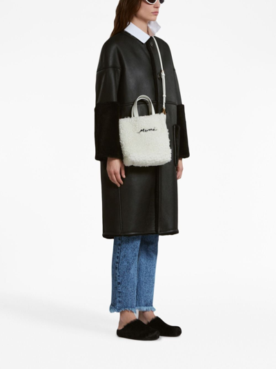 Shop Marni Reversible Shearling Coat In Black