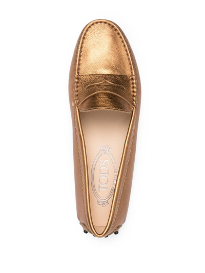 Shop Tod's Metallic-finish Leather Loafers In Gold