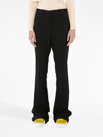 Jw Anderson Flared Trousers In Black