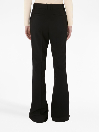 Jw Anderson Flared Trousers In Black