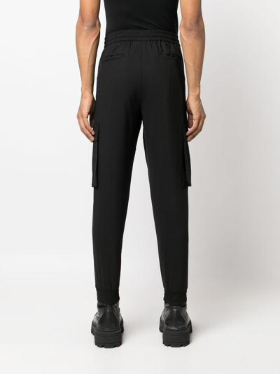 Shop Juunj Tapered-leg Track Pants In Black