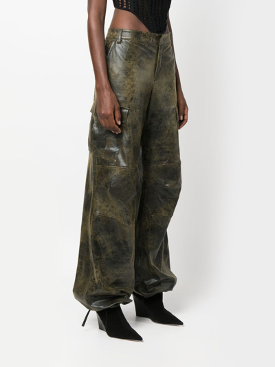 The Andamane Distressed-effect Tapered Trousers In Black