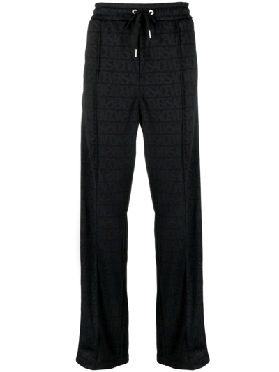 Shop Versace Allover Pattern Track Pants In Black