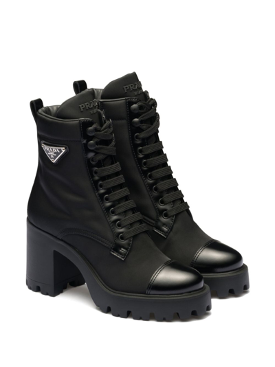 Prada Monolith Leather And Nylon Ankle Boots In Black
