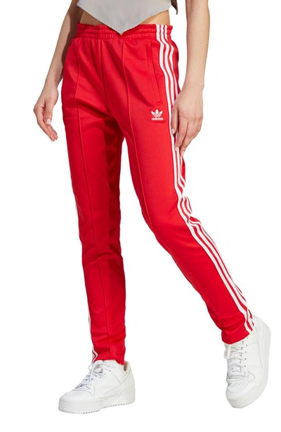 Shop Adidas Originals Superstar Track Pants In Better Scarlet