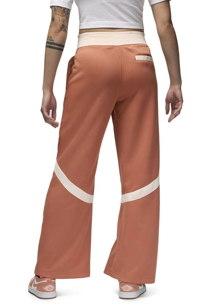 Shop Jordan (her)itage Snap Track Pants In Sky Orange/ Guava Ice