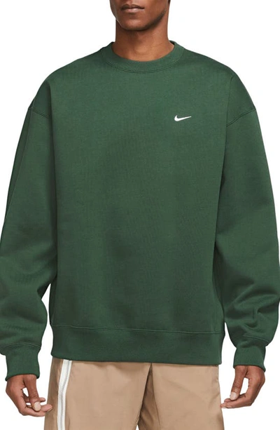 Shop Nike Solo Swoosh Oversize Crewneck Sweatshirt In Fir/ White