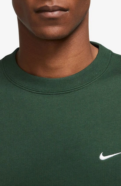 Shop Nike Solo Swoosh Oversize Crewneck Sweatshirt In Fir/ White