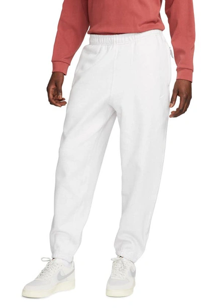 Shop Nike Solo Swoosh Fleece Sweatpants In Birch Heather/ White