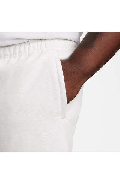 Shop Nike Solo Swoosh Fleece Sweatpants In Birch Heather/ White