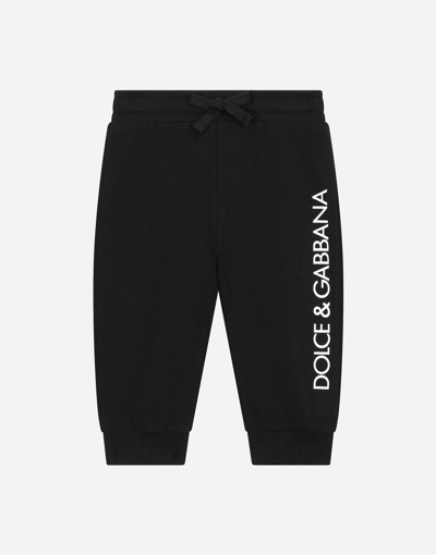 Shop Dolce & Gabbana Jersey Jogging Pants With Logo Print In Black