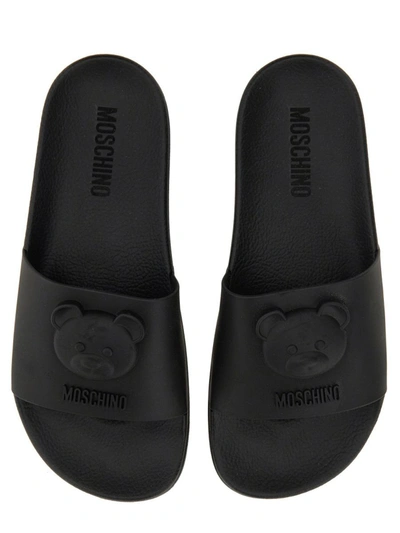 Shop Moschino Teddy Slide Sandal In Black