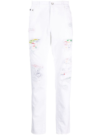 Shop Dolce & Gabbana Ripped-detail Tapered-leg Jeans In White